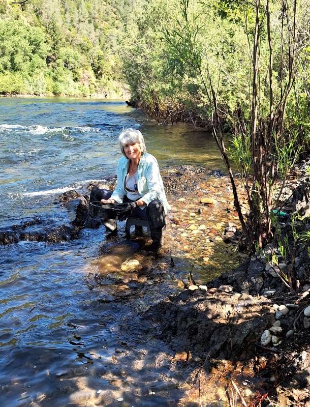 Deb panning along the river.