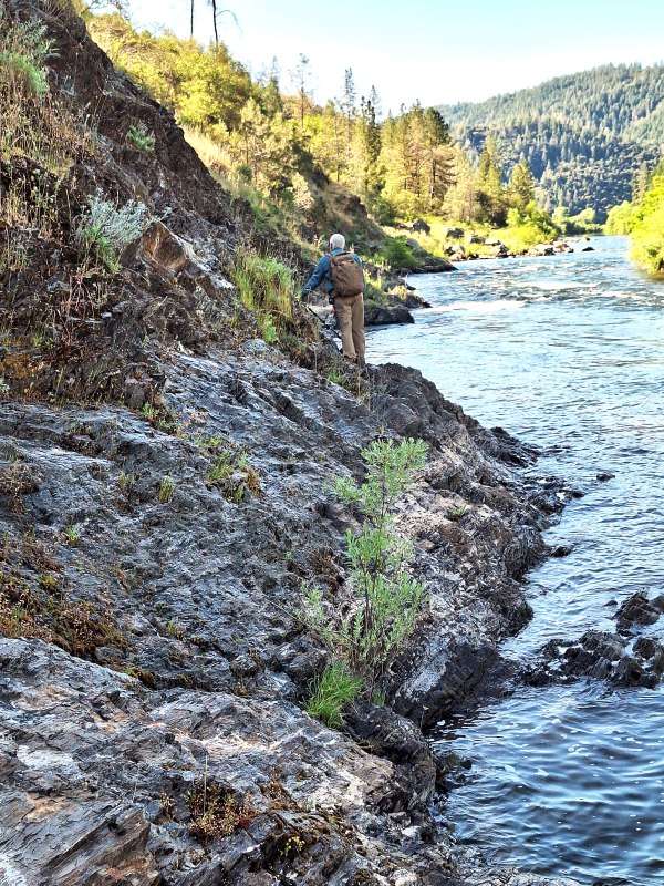 Jim hiking along the bedrock, checking the area out.